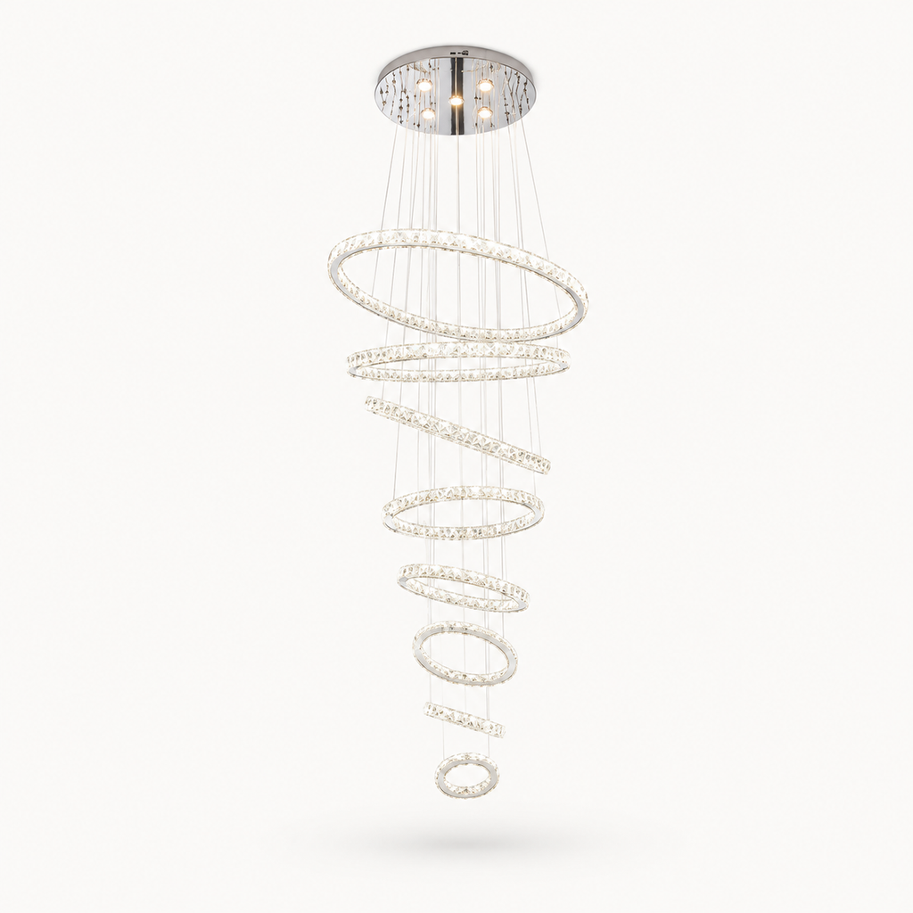 Luxury spiral LED chandelier with crystal ring design and chrome finish for modern staircase and foyer lighting.