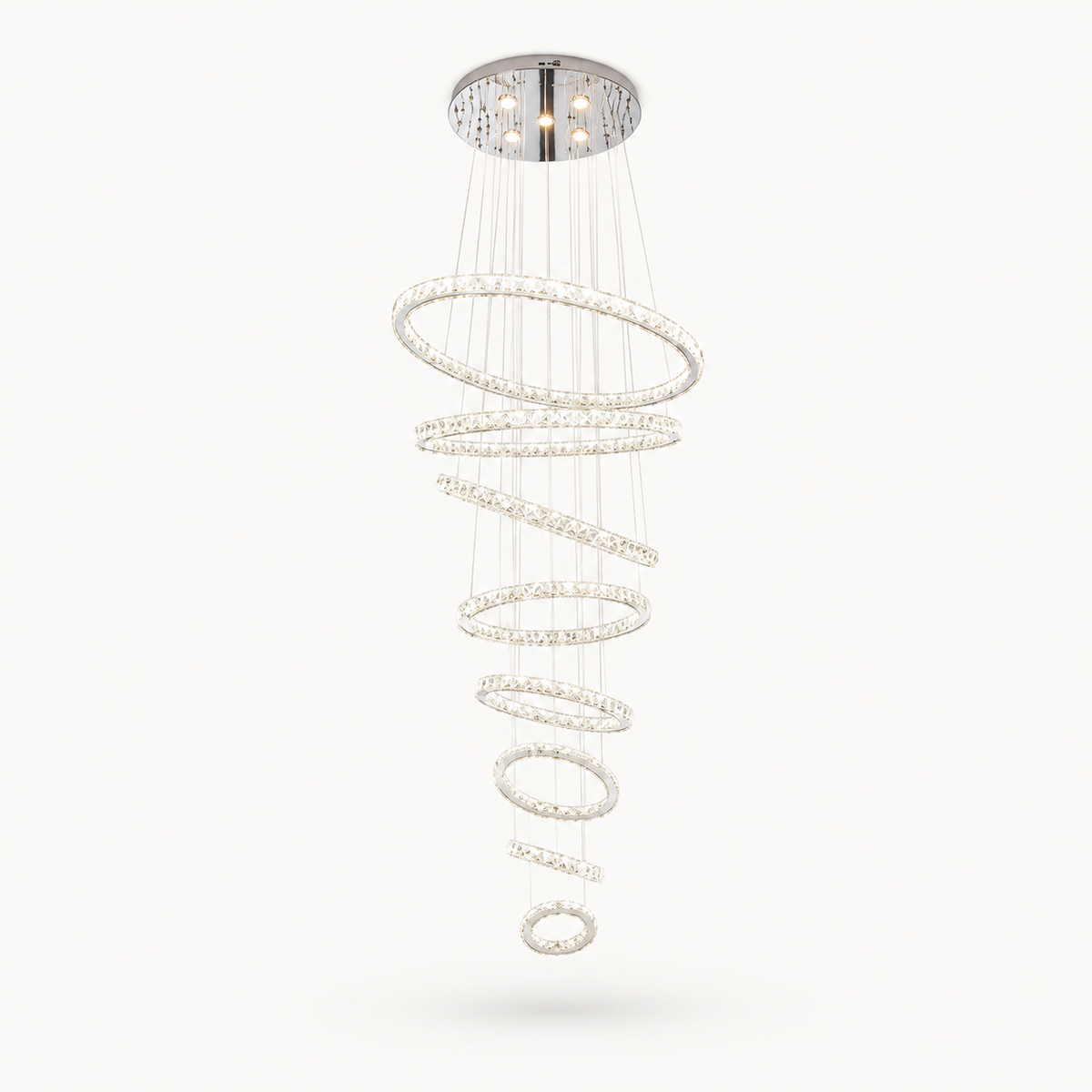 Luxury spiral LED chandelier with crystal ring design and chrome finish for modern staircase and foyer lighting.