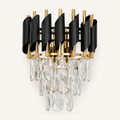 Modern black and gold crystal wall sconce featuring a premium metal finish and elegant ambient lighting for luxury interiors.