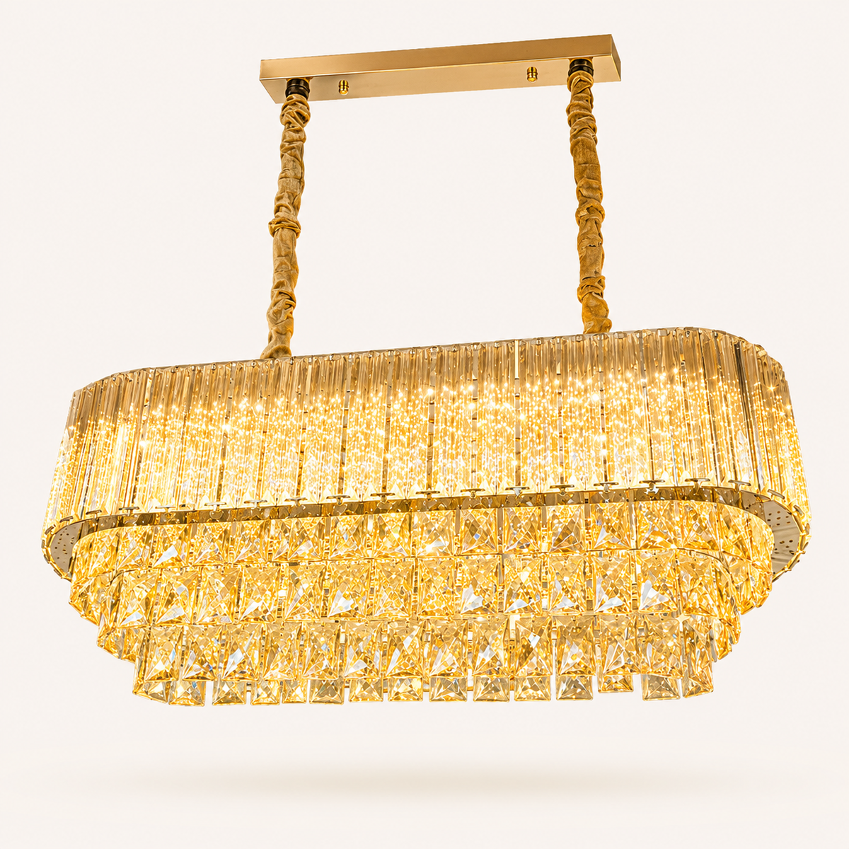 Premium gold LED crystal chandelier with sparkling crystal prisms, suspended by decorative cables, ideal for modern luxury homes in South Africa.